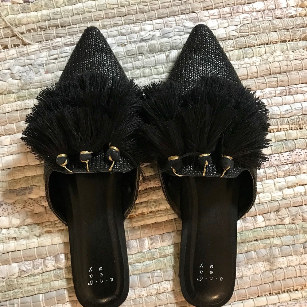 Black slip ons with tassels